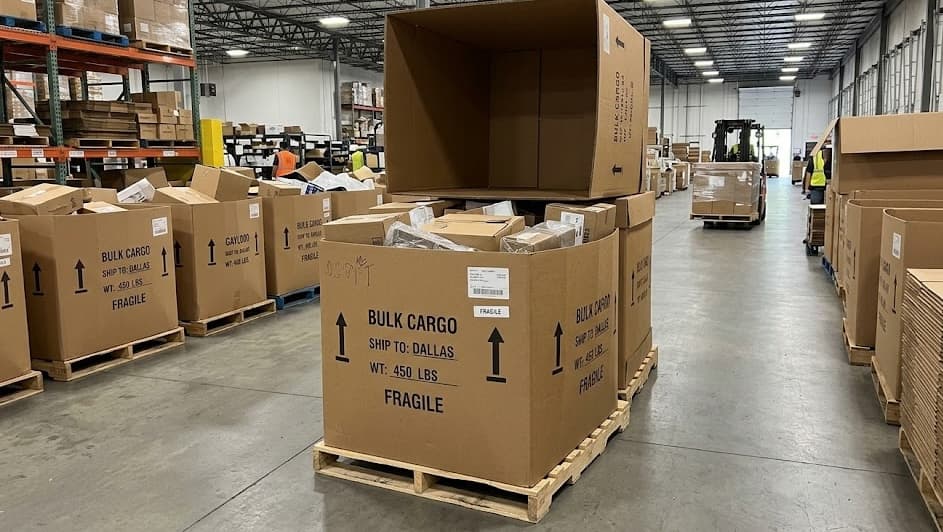 Gaylord boxes on pallets with bulk cargo labels in the warehouse